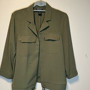 NYCC olive green jacket. Gold details and draw string at bottom. Size Medium.
